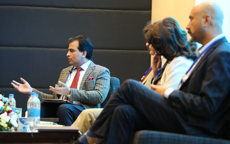 Dr. Mutee ul Rehman, Moderator, facilitating the panel discussion by engaging panellists with key questions on climate change methodologies, green economy, and sustainable development.